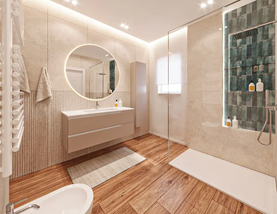 Bagno con mobile sospeso, specchio tondo retroilluminato, doccia con piastrelle verdi e pavimento effetto legno