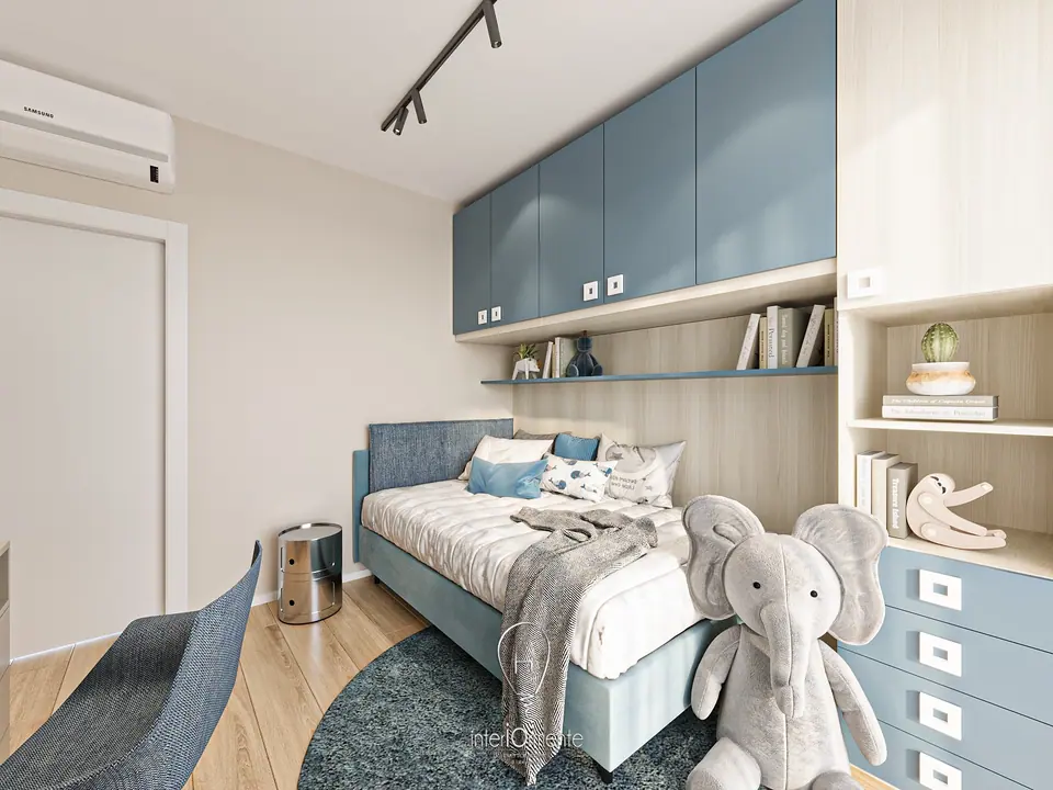 Cameretta con pensili azzurri, letto imbottito blu, libreria in rovere ed elefante di peluche