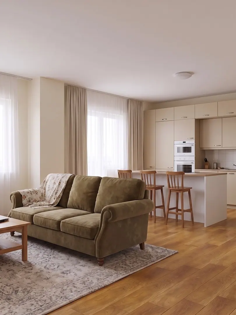 Simulazione con AI dell’open space prima del progetto, con divano in velluto verde oliva, cucina in laminato beige e penisola bianca