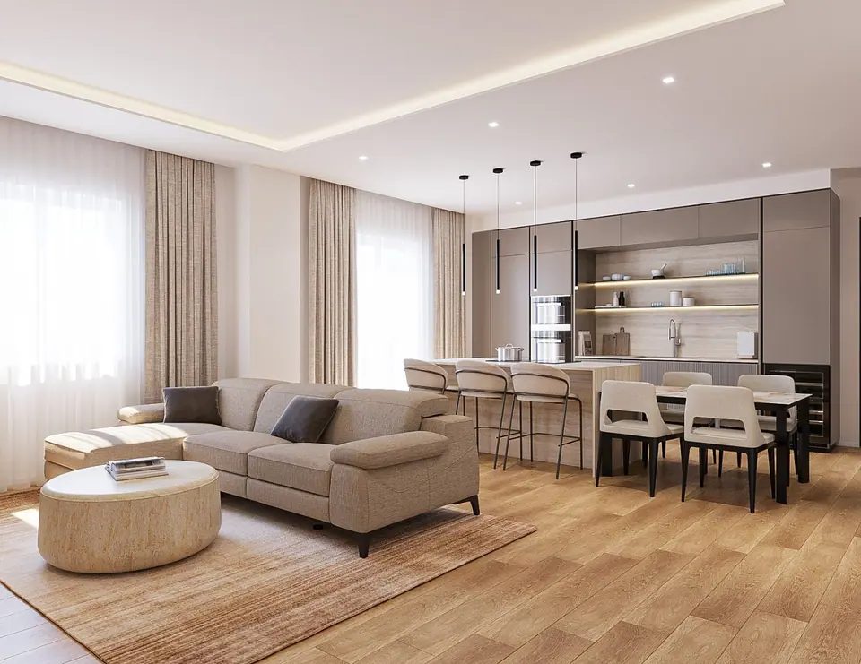 Open space con divano beige, isola con sgabelli, tavolo da pranzo e cucina con mensole illuminate