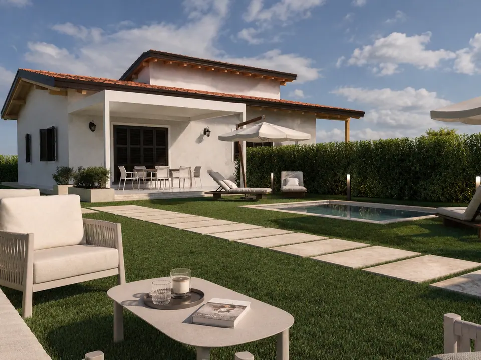 Giardino con prato, camminamento in pietra, piscina e salotto esterno con ombrellone