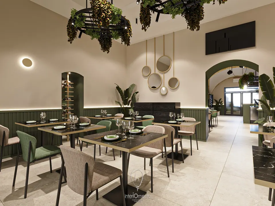 Sala ristorante con boiserie verde, specchi tondi, tavoli in marmo nero e arco verso l'ingresso